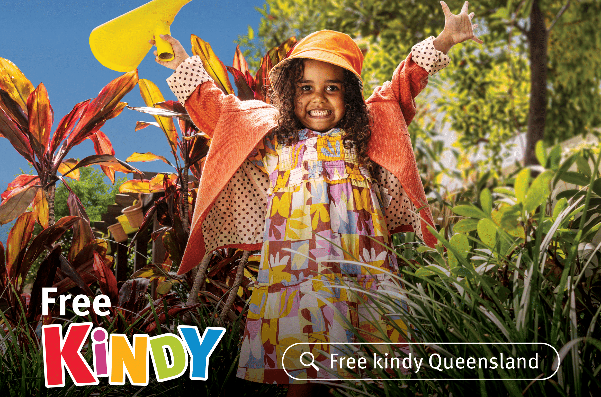 A girl raising both her hands on a Free Kindy poster